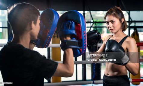 Young Asia Women Doing Kick Exercise During Kickboxing Training With