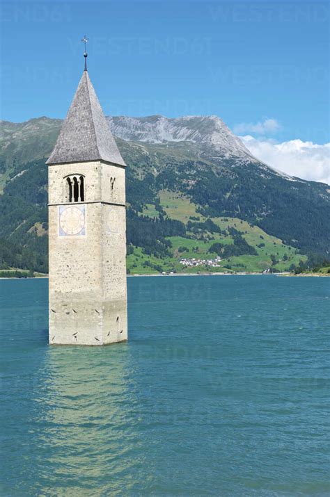 Italy, Alto Adige, Graun im Vinschgau, church tower in lake Reschensee ...