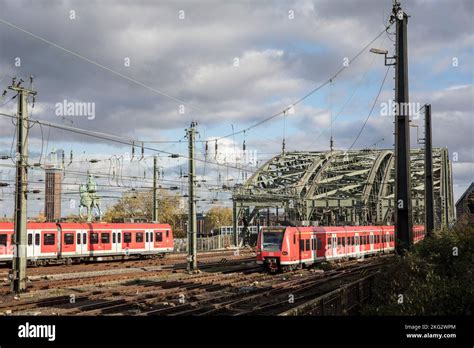 Local Trains On The Hohenzollern Bridge Over The River Rhine Cologne