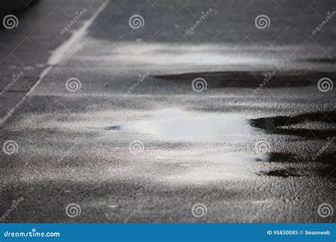 Rain Puddles On A Pavement In The City Stock Image Image Of Paving