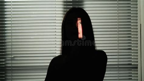 Dark Silhouette Of A Female Activist With A Silhouette Of A Poster