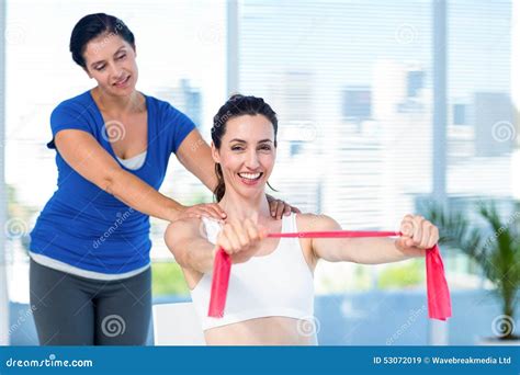 Brunette Stretching With Her Coach And Pink Cloth Stock Image Image Of Body Health