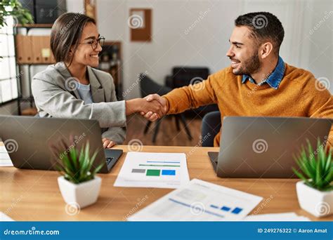 Two Business Workers Shaking Hands At The Office Stock Photo Image Of