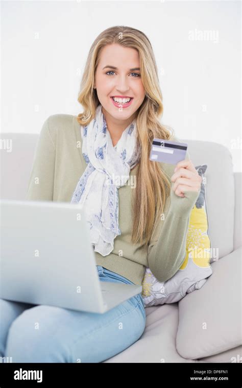 Happy Cute Blonde Using Her Credit Card To Buy Online Stock Photo Alamy