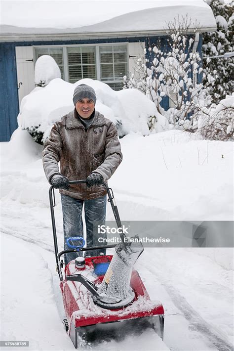 Man Clearing Driveway With Snowblower Stock Photo Download Image Now