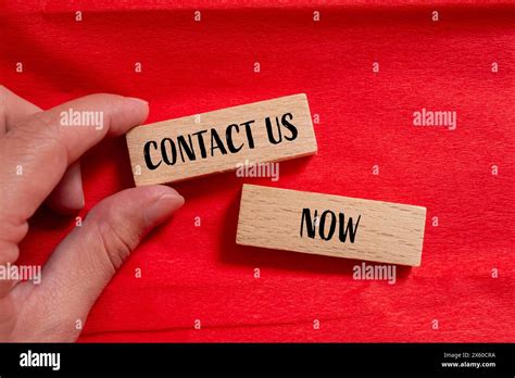 Contact Us Now Words Written On Wooden Blocks With Red Background