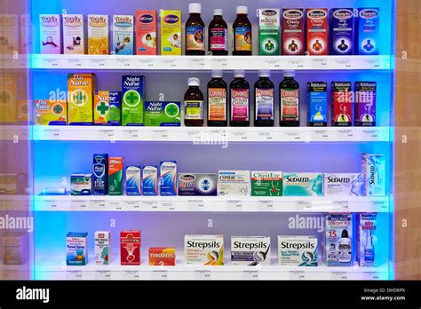 Cold flu remedies and medicine pictured on a pharmacy shelf Stock Photo ...