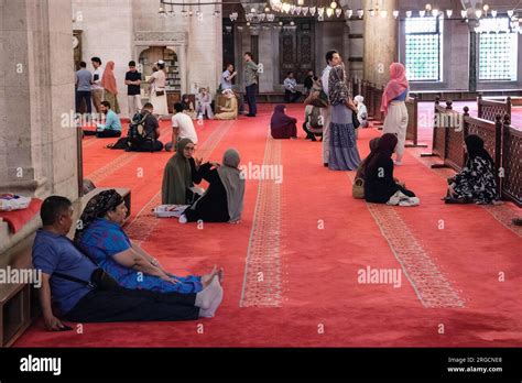 Istanbul Turkey Turkiye Visitors Resting And Talking In The Mosque