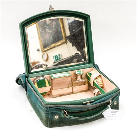 A 1920s Art Deco Vanity Case Wih Fitted Interior Mirrored Lid Four