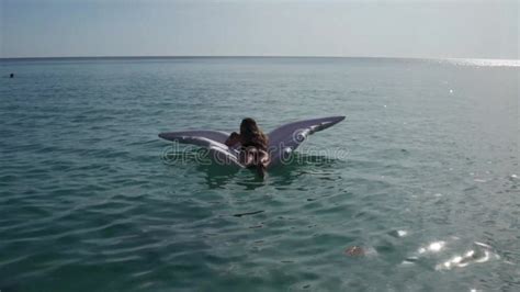 Attractive Woman Wearing Bikini Swimming In The Sea On The Inflatable Wings Stock Video Video