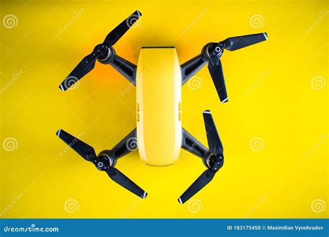 Yellow Drone On A Yellow Background Small Pocket Drone Stock Photo