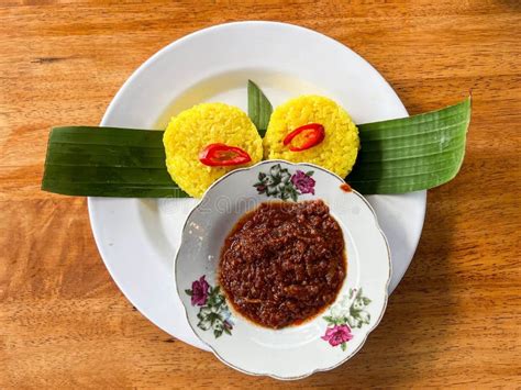 Traditional Malay Food Known As Pulut Kuning With Sambal Tumis Ikan