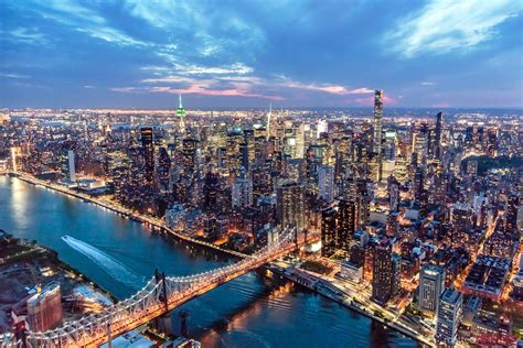 - Aerial of Midtown Manhattan with Empire state building at dusk, New