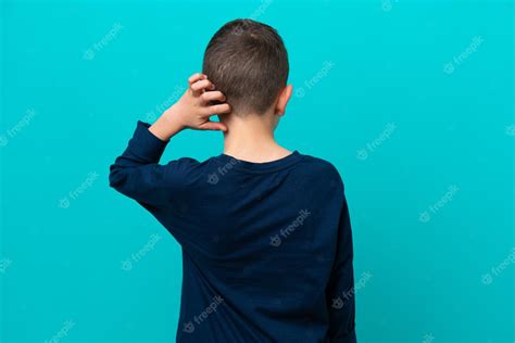 Premium Photo Little Kid Boy Isolated On Blue Background In Back