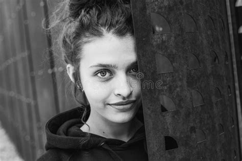 White Brunette Teenage Girl With Curly Hair Poses On The Street In The City Stock Photo Image