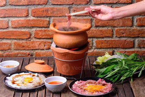 Hot Pot Thai Style Hot Pot With Clear Soup In The Clay Cooking Pot Stock Photo At