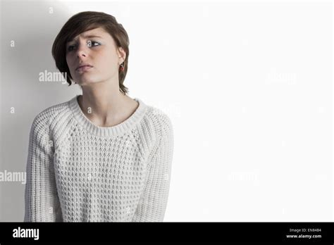 Sad Pretty Brunette Leaning Against Wall Stock Photo Alamy