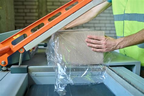 Experienced Warehouse Operator Using Automated Packaging System Stock