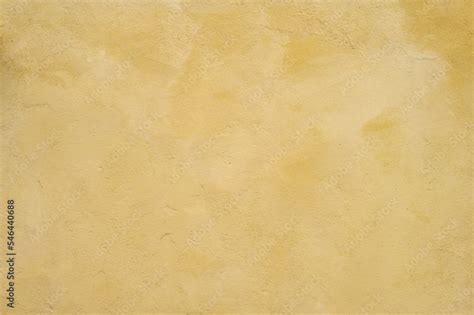 Textured wall in shades of yellow paint, as a graphic background Stock ...