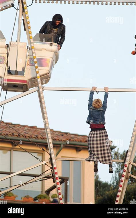 Ciara Captivates With Confidence And Style In A Beach Photoshoot Wearing A Chic Black Bikini