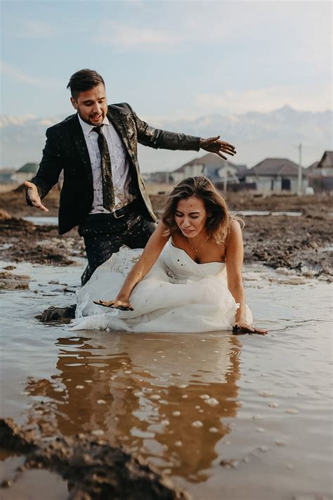 oops groom accidentally drops bride  mud  wedding