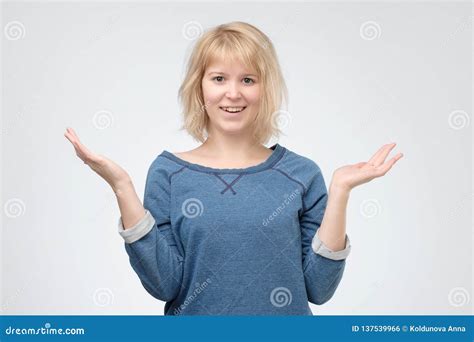 Joyful Excited Blonde Woman Dressed In Blue Pulover Is Shocked Stock Photo Image Of Amazed