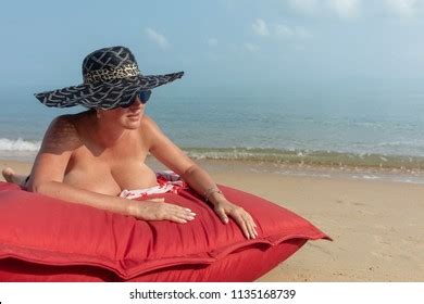 Woman Nude Black Hat Sunglasses Lies Stock Photo 1135168739 Shutterstock