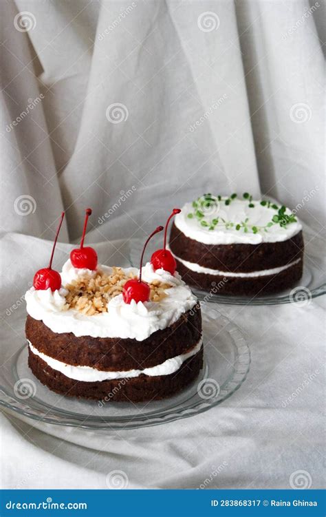 Chocolate Naked Cake With Cream Frosting And Decorated With Cherry Peanut And Thyme Stock Image