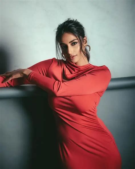 Hot Meenakshi Chaudhary Displays Her Big Boobs And Sexy Body In Gorgeous Red Dress