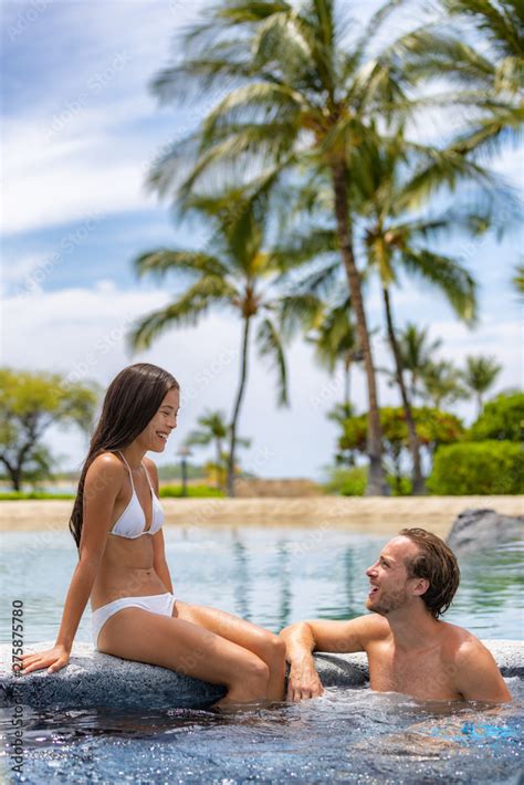 Spa resort couple relaxing enjoying jacuzzi hot tub swimming pool ...