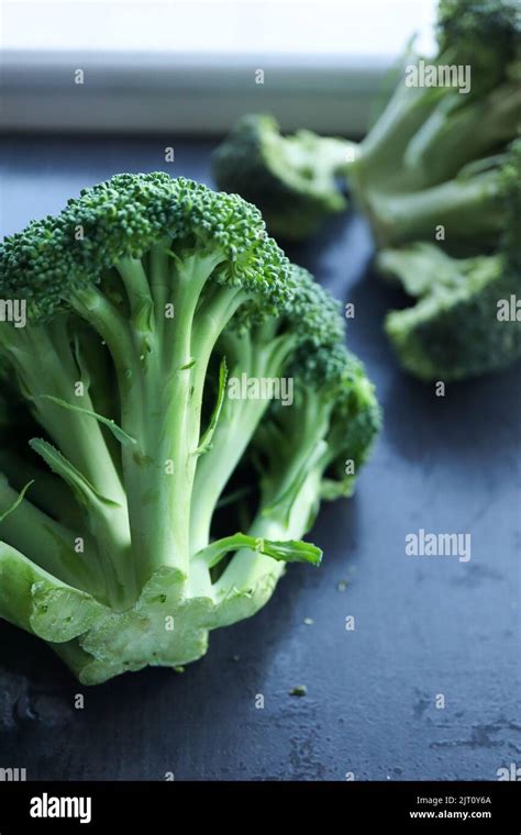 broccoli florets   dark background stock photo alamy