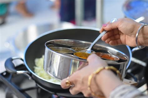 woman cooking indian food  stock photo