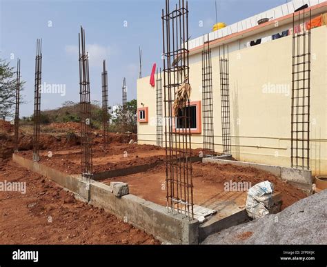 vertical   metallic rebars   concrete   construction