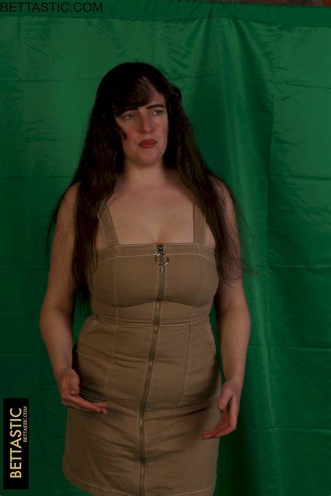 Brunette Chick Takes Off Her Dress And Shows Her Big Ass Photos