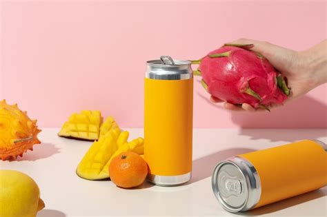 Premium Photo Tropical Fruit Tin Cans And Hand On Light Pink Background