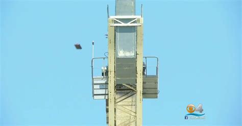 Police Naked Man Climbs Foot Crane Drops Heavy Objects CBS News