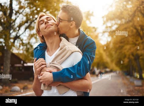 Loving Gay Couple Walking Outdoors Two Handsome Men Having Romantic Date In Park LGBT Concept
