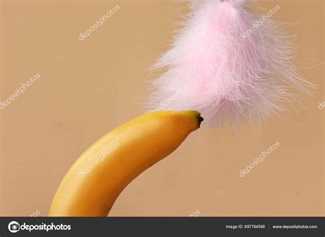 Banana Feather Stick Beige Background Closeup Sex Concept Stock Photo Serezniy 697764598