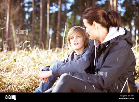 Mature Woman Taking A Break With Her Son In A Forest Stock Photo Alamy