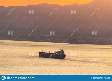 Sunset Colors With A Cargo Ship Travelling In The Messenian Gulf In