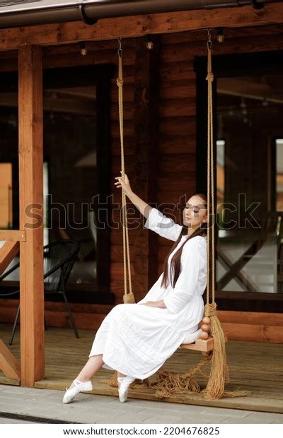 Beautiful Brunette White Dress Poses Sitting Stock Photo Shutterstock
