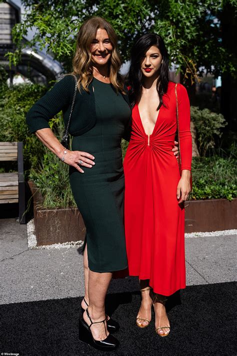 Olivia Wilde Pairs Tiny HOT PANTS With Sheer Stockings And Go Go Boots During Michael Kors