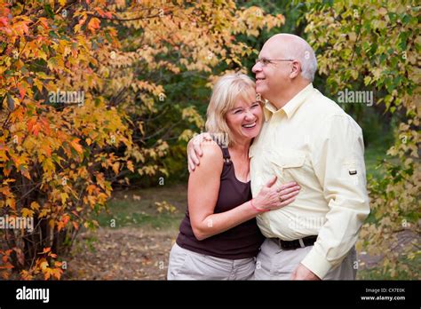 Mature Married Couple Spending Time Together In A Park In Autumn Edmonton Alberta Canada