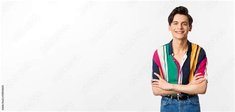 Hansome Smiling Gay Man Looking Happy Standing Over White Background In Summer Outfit Stock