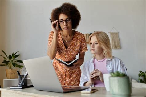 A Multicultural Lesbian Couple Works Together Stock Image Image Of