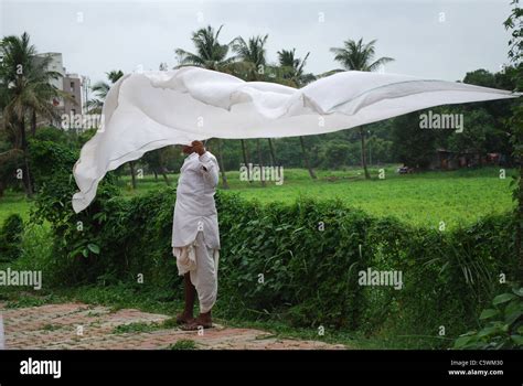 man drying cloth Stock Photo - Alamy