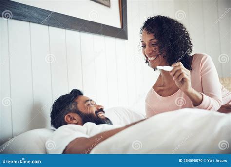 Here Comes Parenthood A Mature Couple Feeling Happy After Taking A Home Pregnancy Test Stock