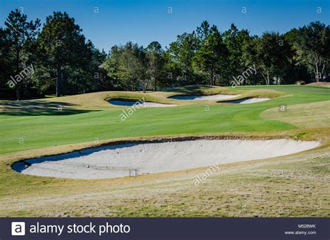 In Golf Bunkers Or Sand Traps Are Shallow Pits Filled With Sand And