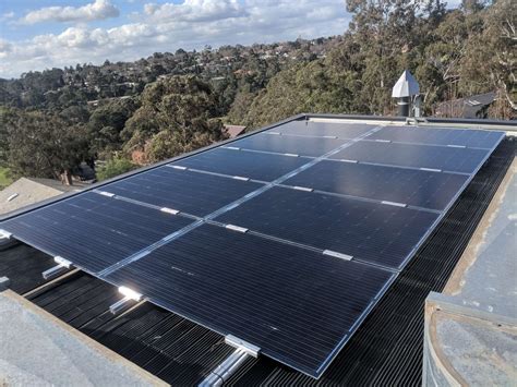 Installing glass solar panels on top of a solar pool blanket | RACV Solar