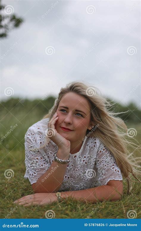 Pretty Teenage Girl With Long Blonde Hair Lying In A Field Stock Photo Image Of Girl Relax